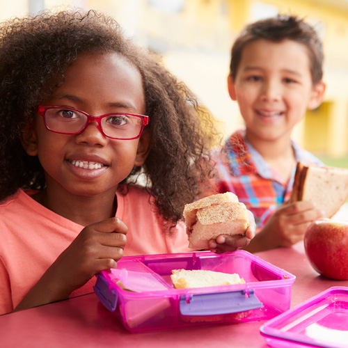 Two children eating lunch together